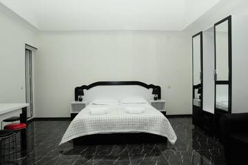 Фото номера Четырехместный номер &quot;Комфорт&quot; Гостевой дом HOTEL Tacho г. Боржоми 6
