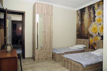 Фото номера Двухместный номер с 2 отдельными кроватями Гостевой дом nimako г. Боржоми 7