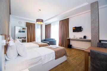Фото номера Четырехместный номер Делюкс Отель Rustaveli Borjomi Hotel г. Боржоми 11